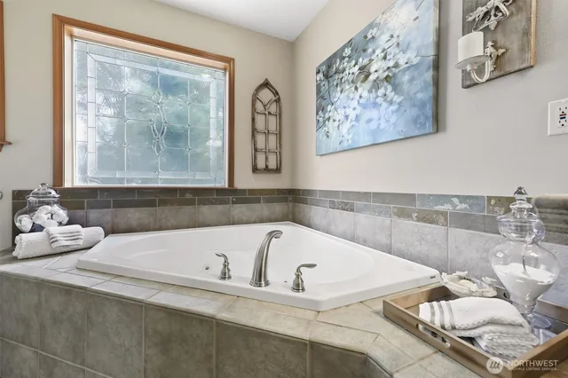 a bathroom with a bathtub and shower