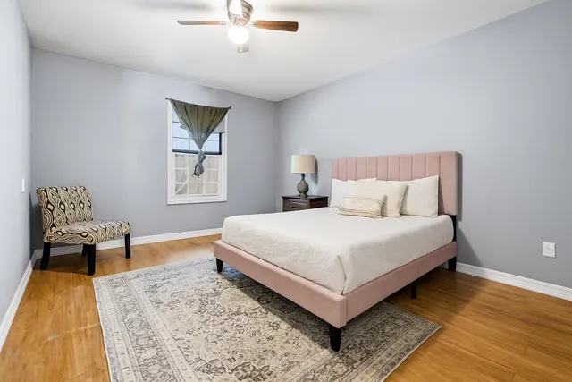 a bedroom with a bed and window