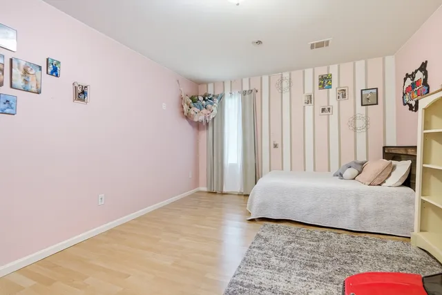 a bedroom with a bed and a couch