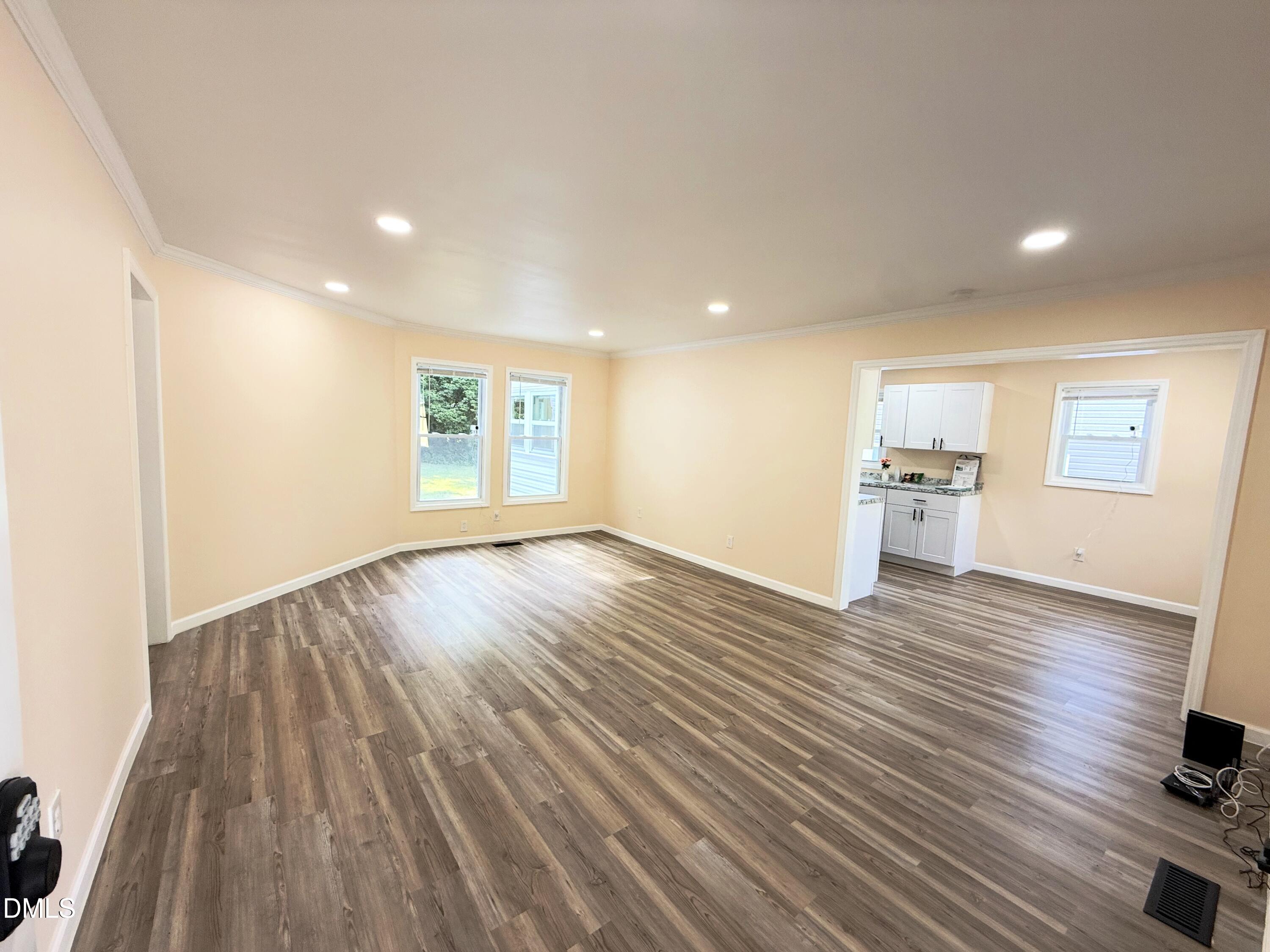 417 North Street Graham, NC 27253 - Photo 2 of 18 a view of empty room with wooden floor