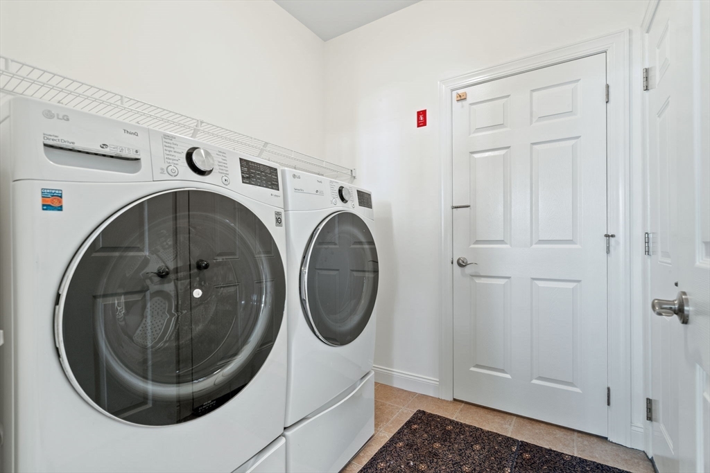 11 Pondside Lane, Unit 11 Bolton, MA 01740 - Photo 12 of 32 a utility room with dryer and washer