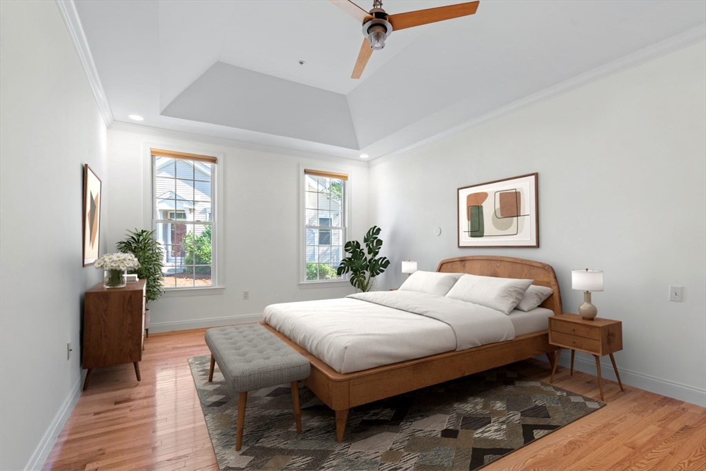 11 Pondside Lane, Unit 11 Bolton, MA 01740 - Photo 21 of 32 a bedroom with a bed and wooden floor