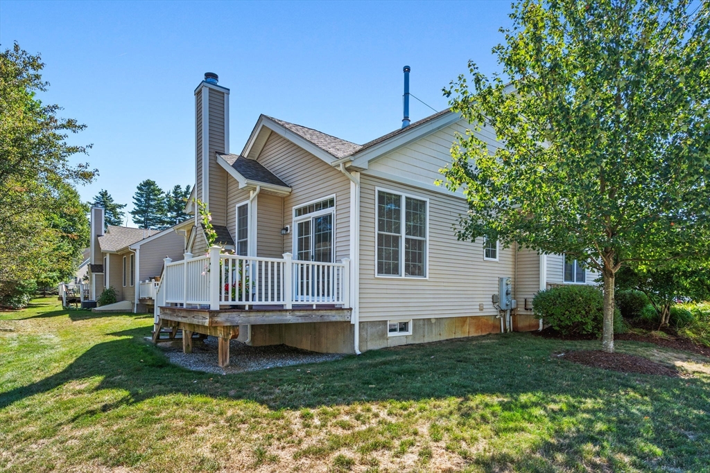11 Pondside Lane, Unit 11 Bolton, MA 01740 - Photo 24 of 29 a house view with a garden space