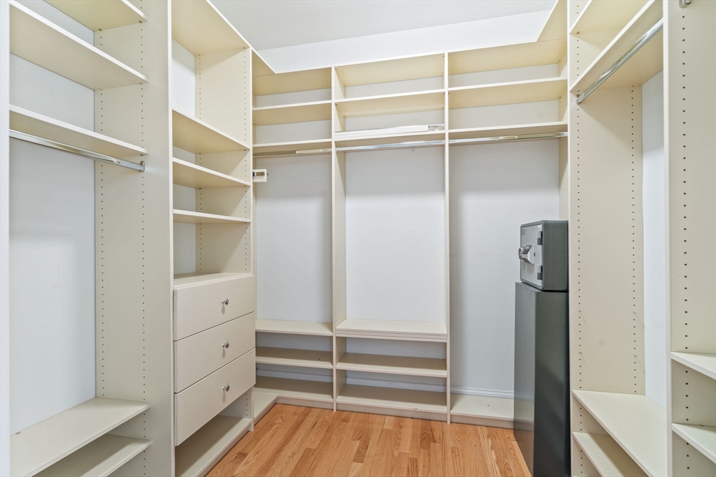 11 Pondside Lane, Unit 11 Bolton, MA 01740 - Photo 25 of 32 a view of walk in closet with empty racks