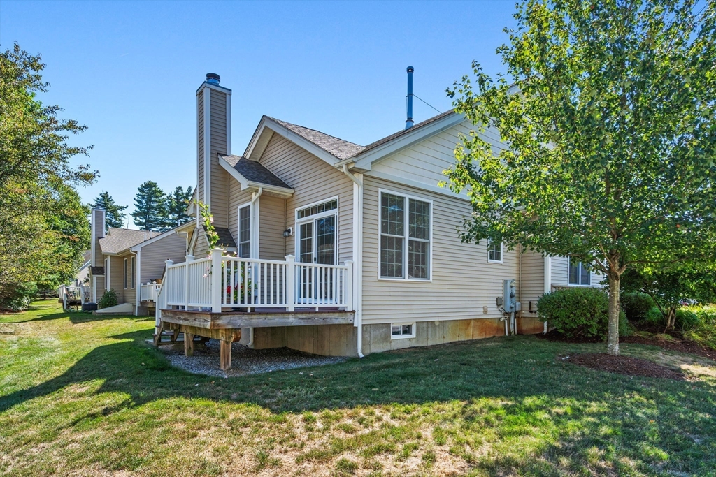 11 Pondside Lane, Unit 11 Bolton, MA 01740 - Photo 27 of 32 a house view with a garden space