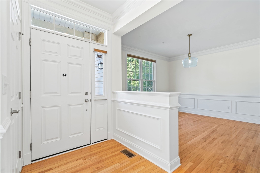 11 Pondside Lane, Unit 11 Bolton, MA 01740 - Photo 8 of 32 a view of a room with wooden floor and cabinet