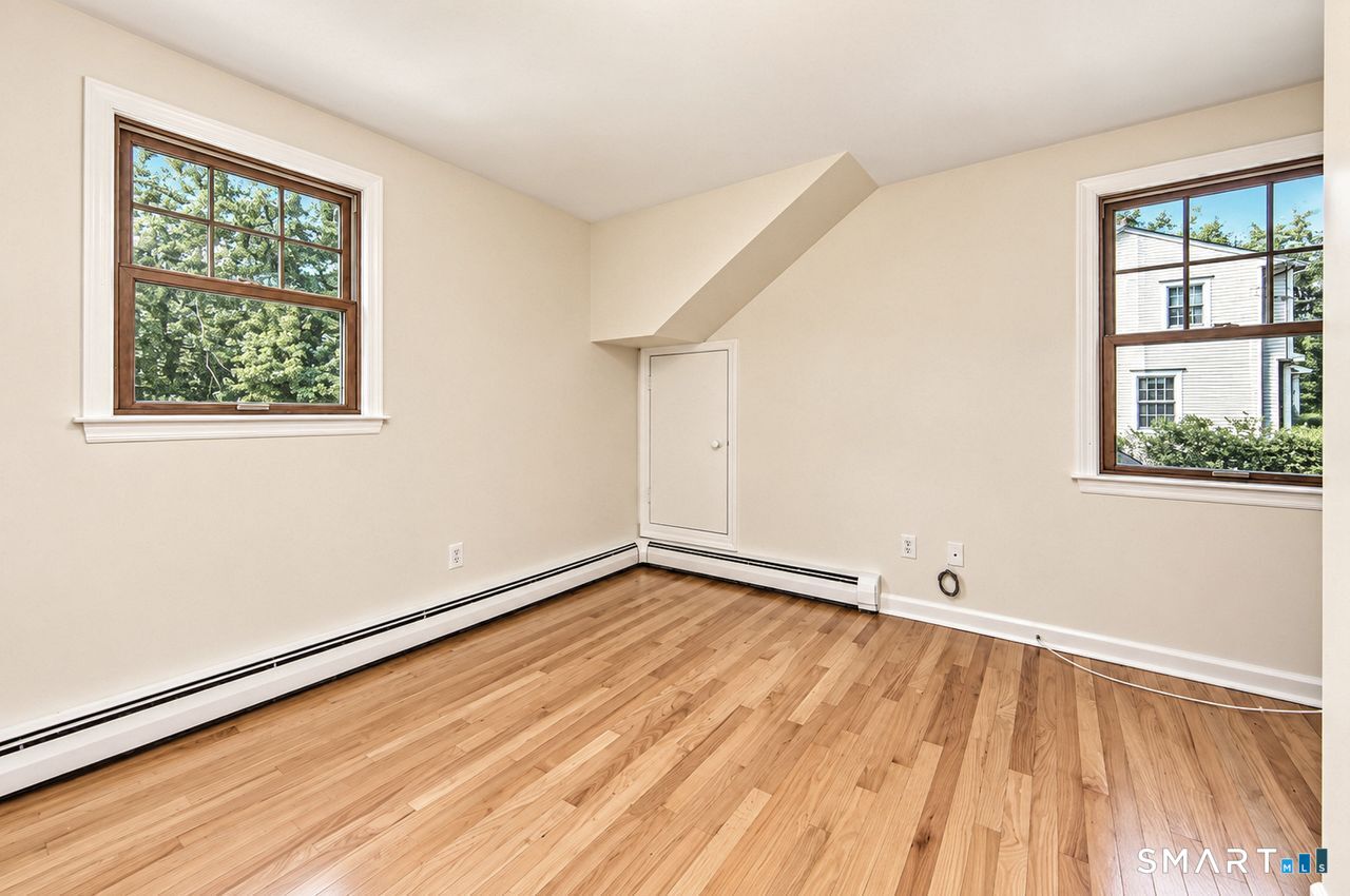 185 Nepas Road Fairfield, CT 06825 - Photo 28 of 38 Bedroom #4 or office. Door access to attic over the garage.