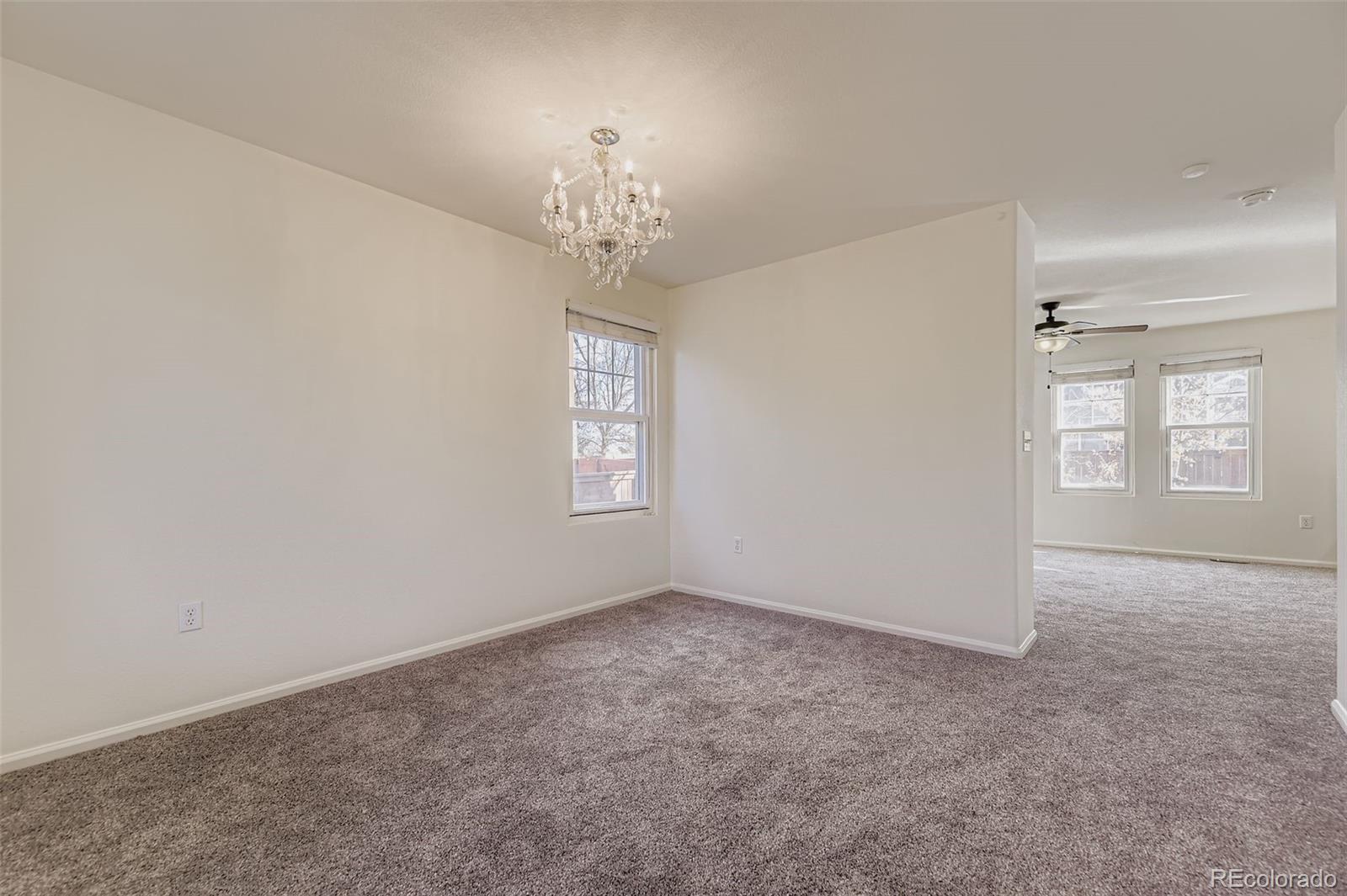 2430 South Jebel Way Aurora, CO 80013 - Photo 13 of 28 a view of an empty room with a window