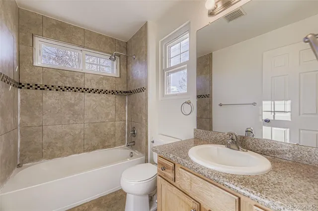 a bathroom with a sink a toilet and a bathtub