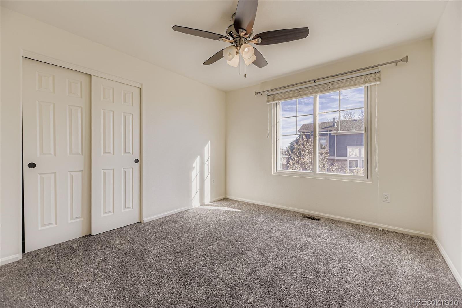 2430 South Jebel Way Aurora, CO 80013 - Photo 21 of 28 a view of an empty room with a window