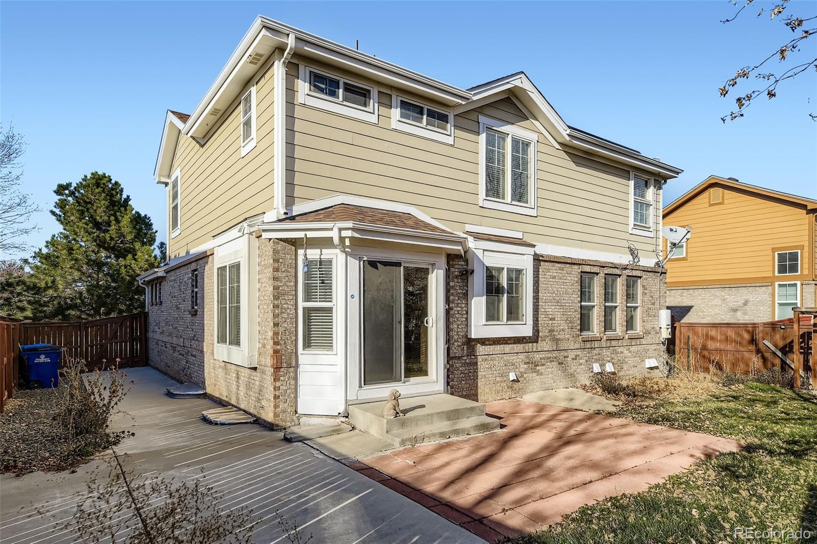 2430 South Jebel Way Aurora, CO 80013 - Photo 27 of 28 a front view of a house with a yard