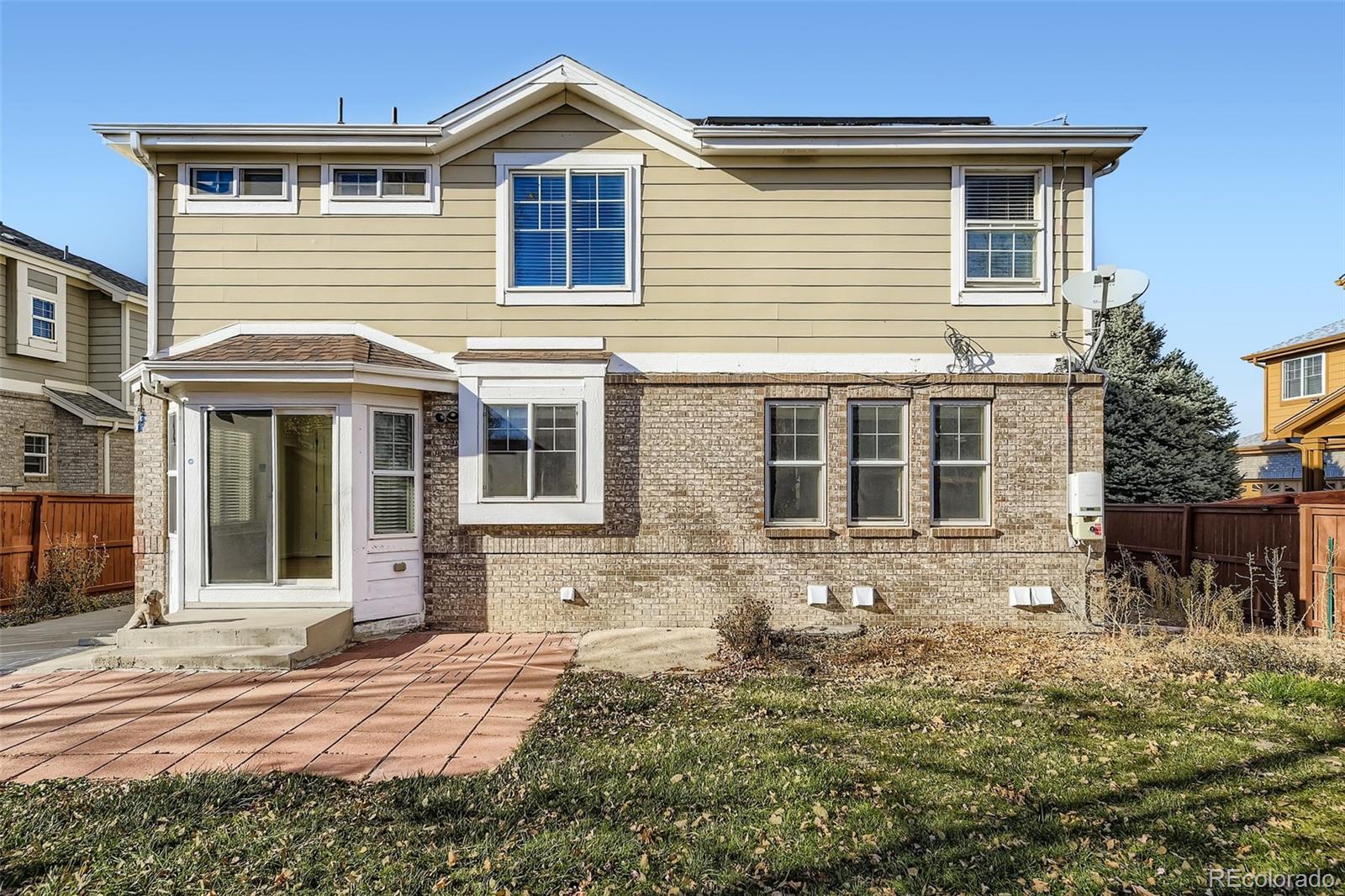 2430 South Jebel Way Aurora, CO 80013 - Photo 28 of 28 a front view of a house with a yard