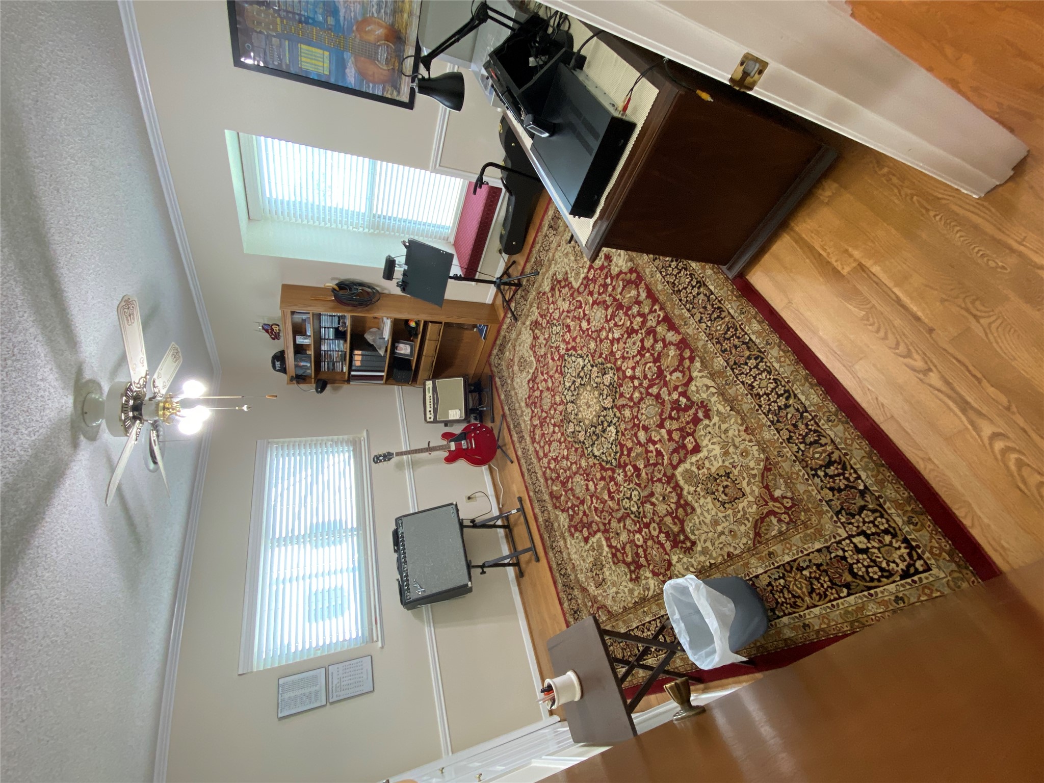 140 Oak Ridge Road Georgetown, TX 78628 - Photo 36 of 40 Living area featuring light wood-style flooring, a textured ceiling, a ceiling fan, and crown molding
