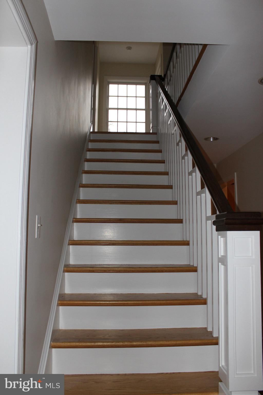 4 Sherwood Road Annapolis, MD 21401 - Photo 33 of 46 wood stairs to second floor by foyer