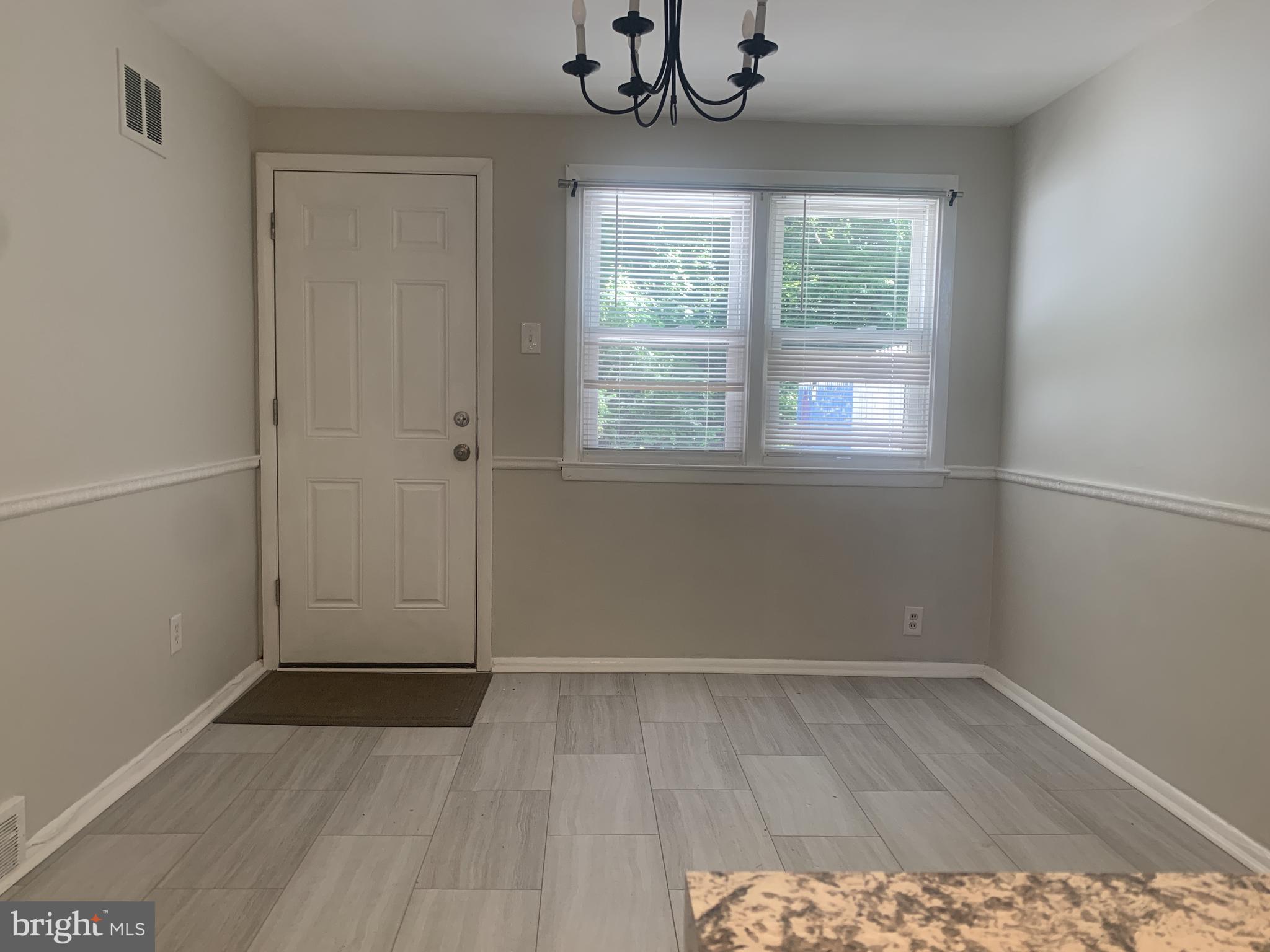 163 Wiltshire Road Claymont, DE 19703 - Photo 9 of 32 Dining area that leads to patio and parking