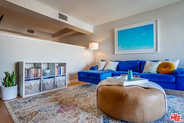 a bed room with furniture and book shelf