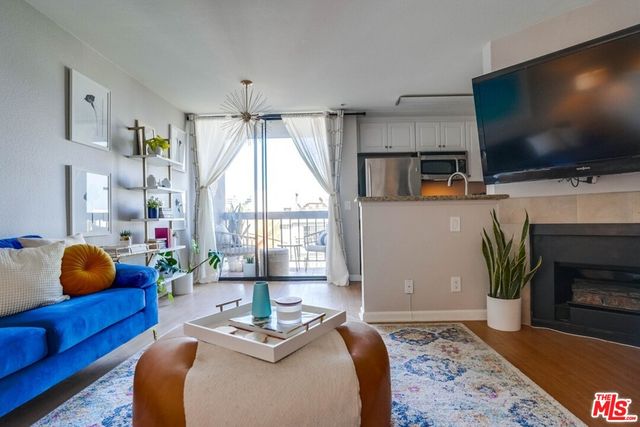 a bedroom with furniture and a flat screen tv