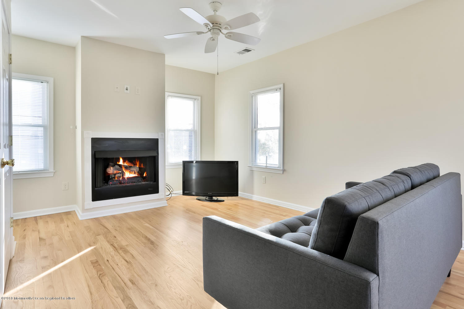 825 River Road, Unit A Fair Haven, NJ 07704 - Photo 2 of 11 a living room with furniture and a fireplace