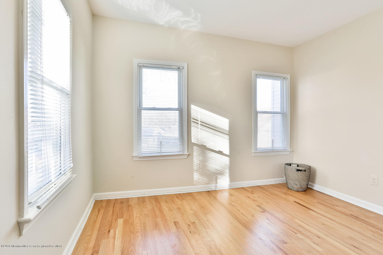 825 River Road, Unit A Fair Haven, NJ 07704 - Photo 3 of 11 a view of empty room with wooden floor and fan