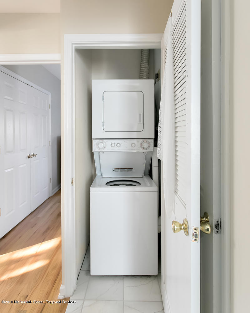 825 River Road, Unit A Fair Haven, NJ 07704 - Photo 10 of 11 a utility room with dryer and washer
