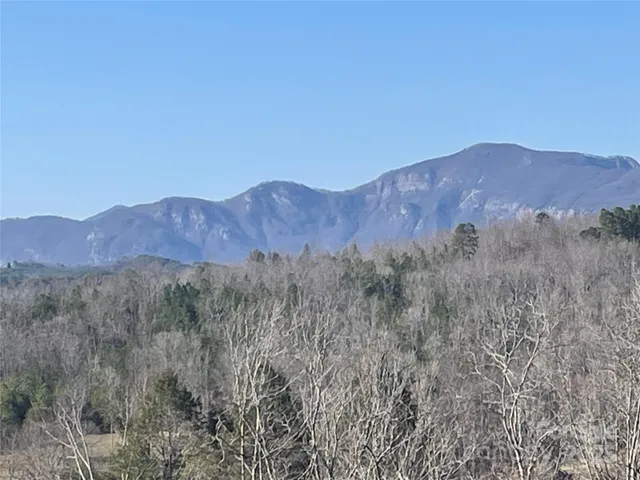 a view of mountains and valleys