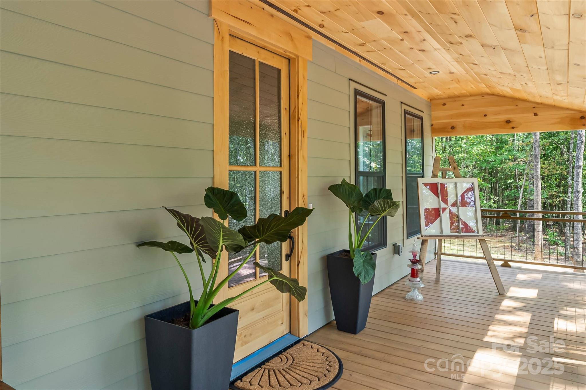 5251 Mt Olive Church Road Morganton, NC 28655 - Photo 20 of 43 a view of a deck with wooden floor and a potted plant