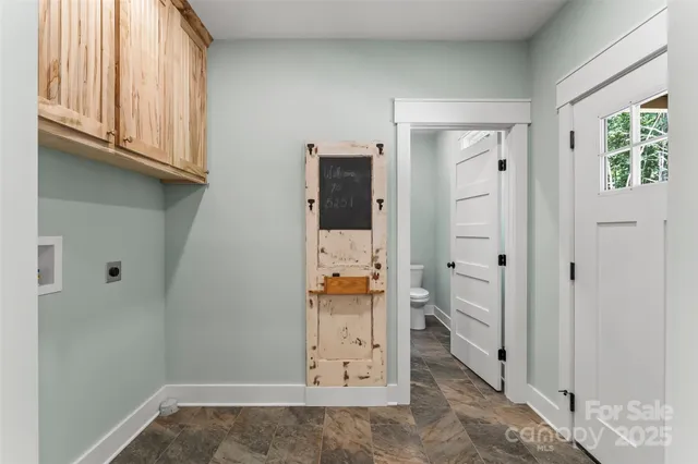 hallway view with wooden floor and staircase