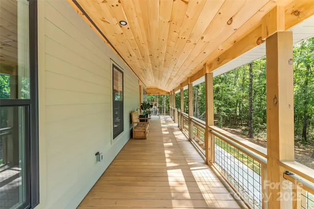 a view of a balcony with wooden floor
