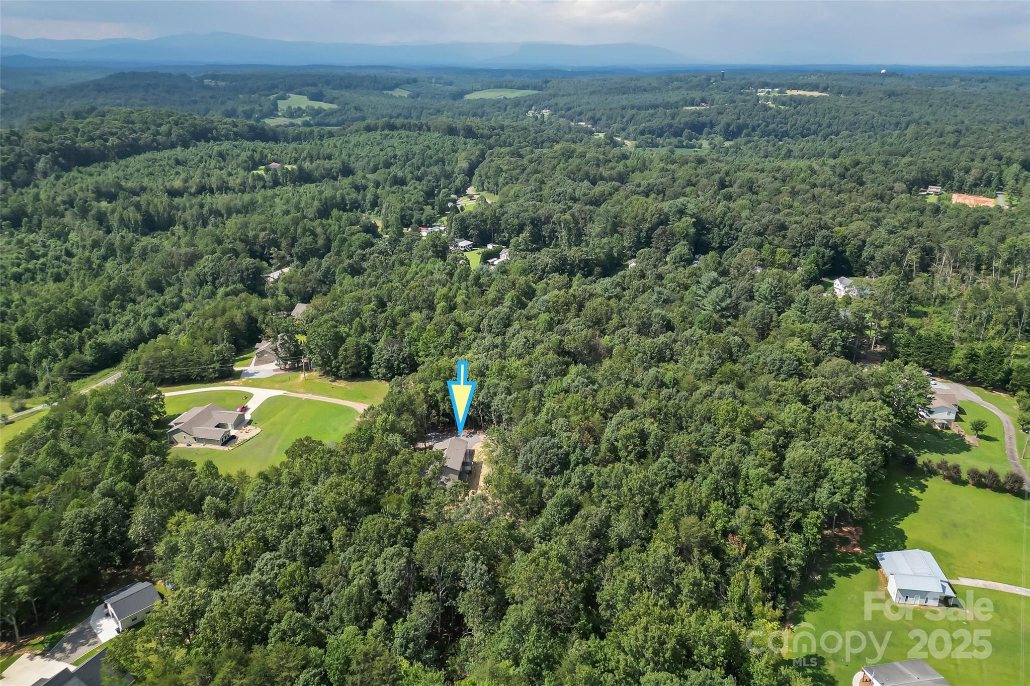 5251 Mt Olive Church Road Morganton, NC 28655 - Photo 34 of 43 a view of a swimming pool and mountains in the background