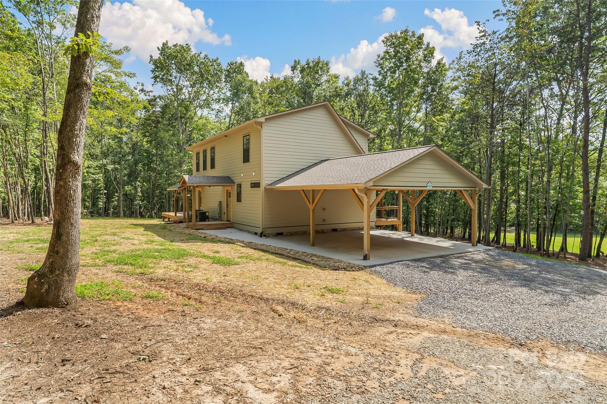 5251 Mt Olive Church Road Morganton, NC 28655 - Photo 35 of 43 a view of a house with backyard and sitting area