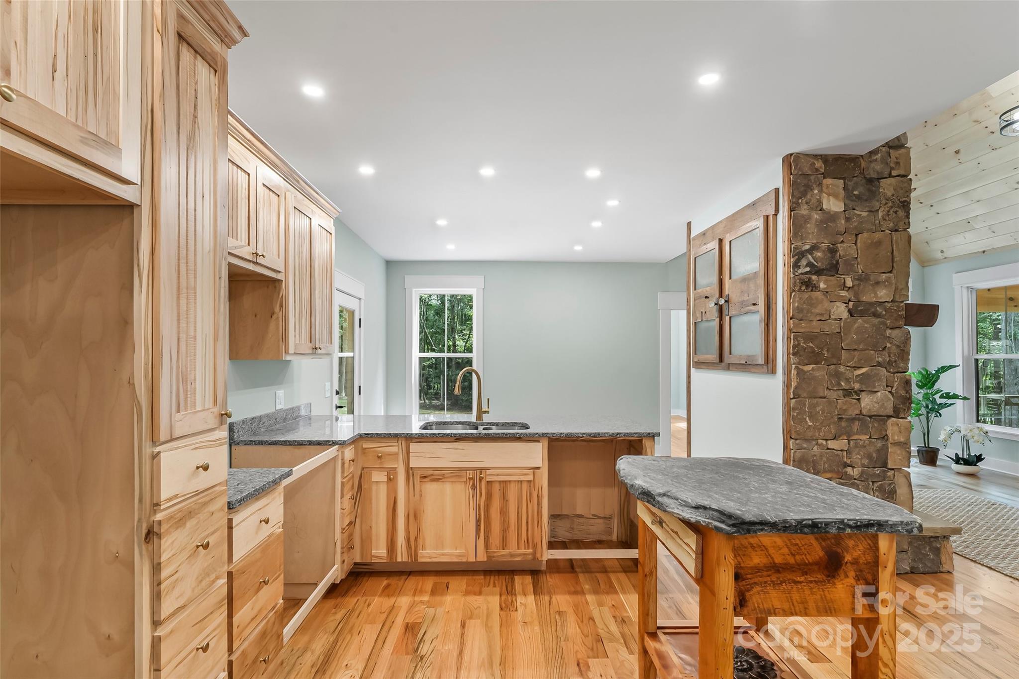5251 Mt Olive Church Road Morganton, NC 28655 - Photo 9 of 43 a bathroom with a granite countertop sink a mirror and a bathtub