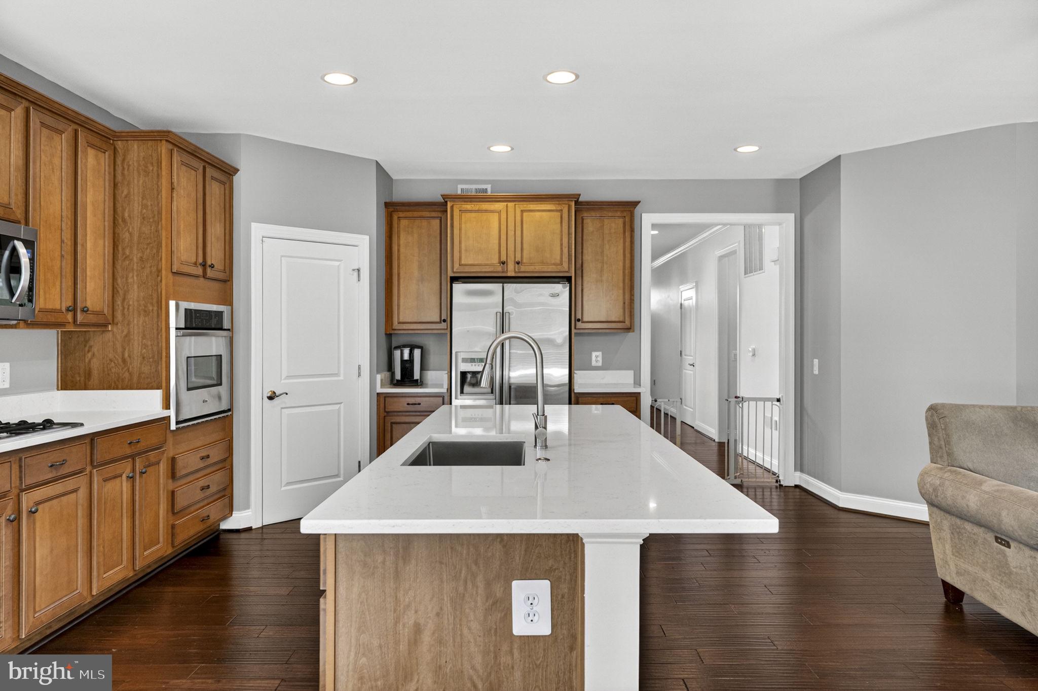 109 Tutelo Lane White Post, VA 22663 - Photo 15 of 54 a view of a kitchen with kitchen island stainless steel appliances wooden floor dining table and chairs