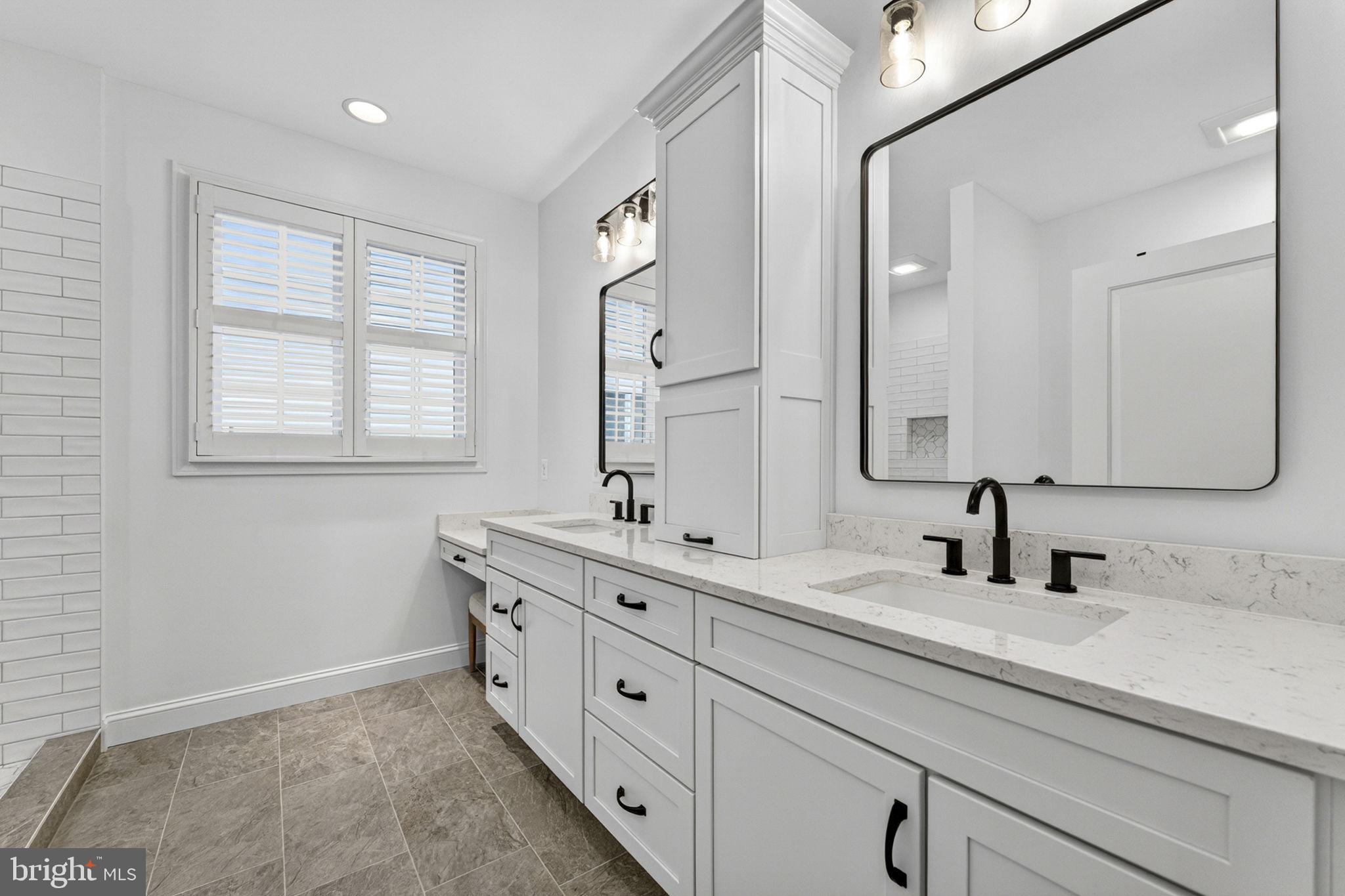 109 Tutelo Lane White Post, VA 22663 - Photo 28 of 54 a bathroom with double sink and a mirror