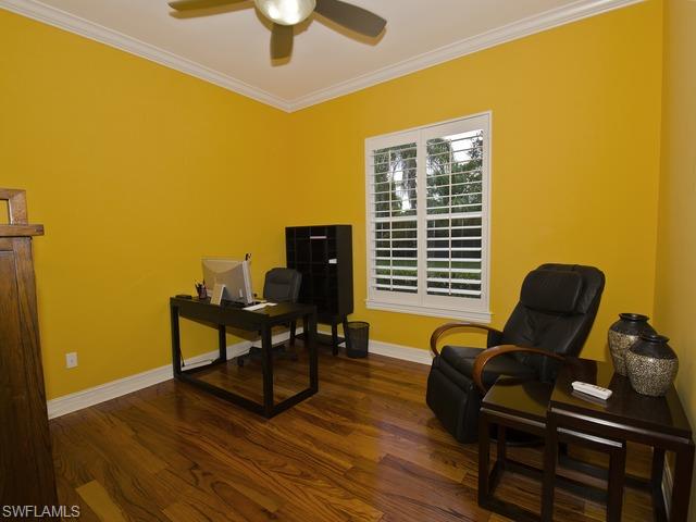 5030 Rustic Oaks Circle Naples, FL 34105 - Photo 12 of 12 a view of a workspace with furniture and a window