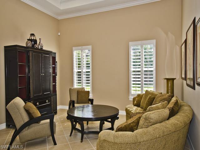 5030 Rustic Oaks Circle Naples, FL 34105 - Photo 4 of 12 a living room with furniture and a window