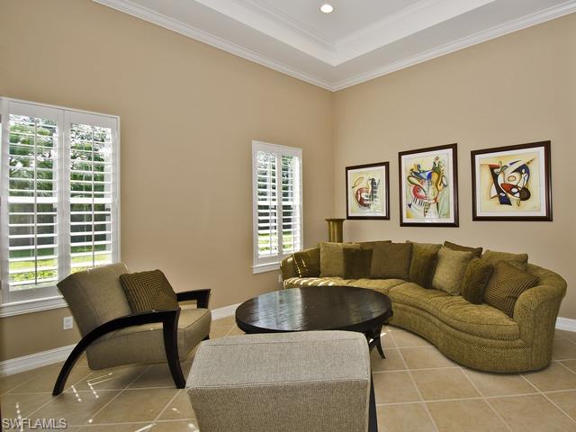 5030 Rustic Oaks Circle Naples, FL 34105 - Photo 5 of 12 a living room with furniture and a window