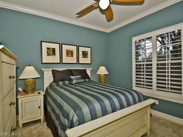 5030 Rustic Oaks Circle Naples, FL 34105 - Photo 10 of 12 a bedroom with double bed and a window