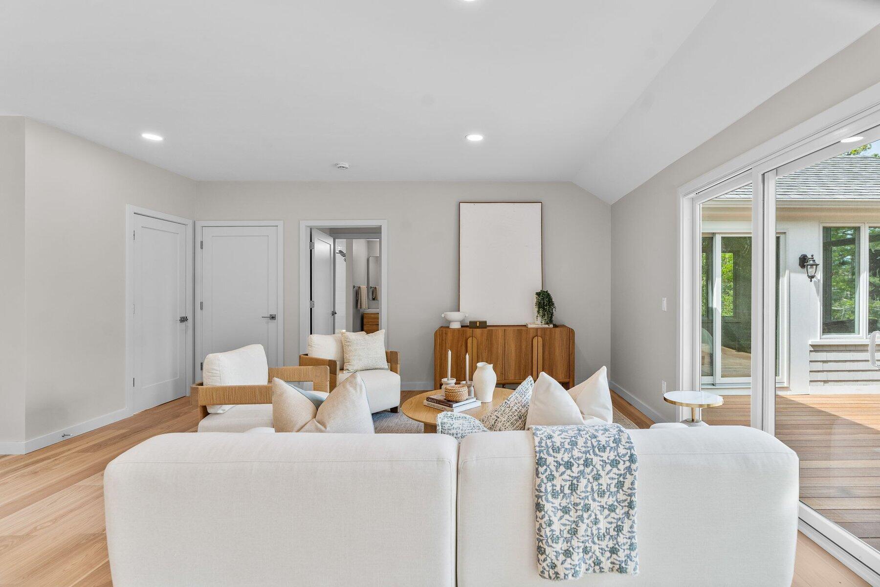 162 Main Street Osterville, MA 02655 - Photo 12 of 50 a bedroom with a bed and wooden floor