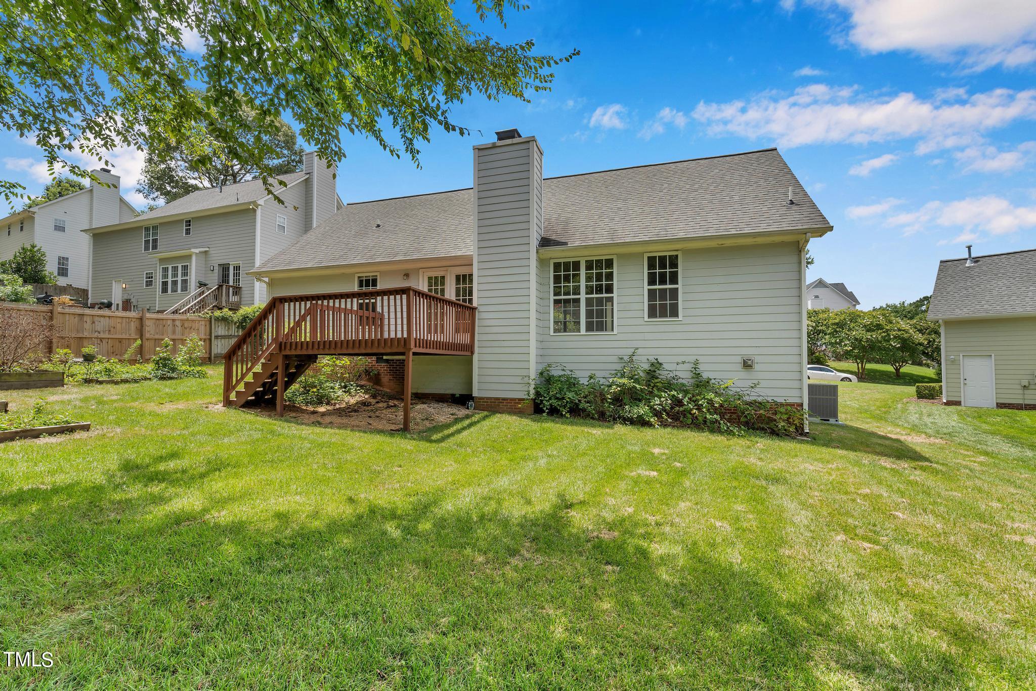 2505 Tryon Pines Drive Raleigh, NC 27603 - Photo 18 of 21 a view of a house with backyard and sitting area