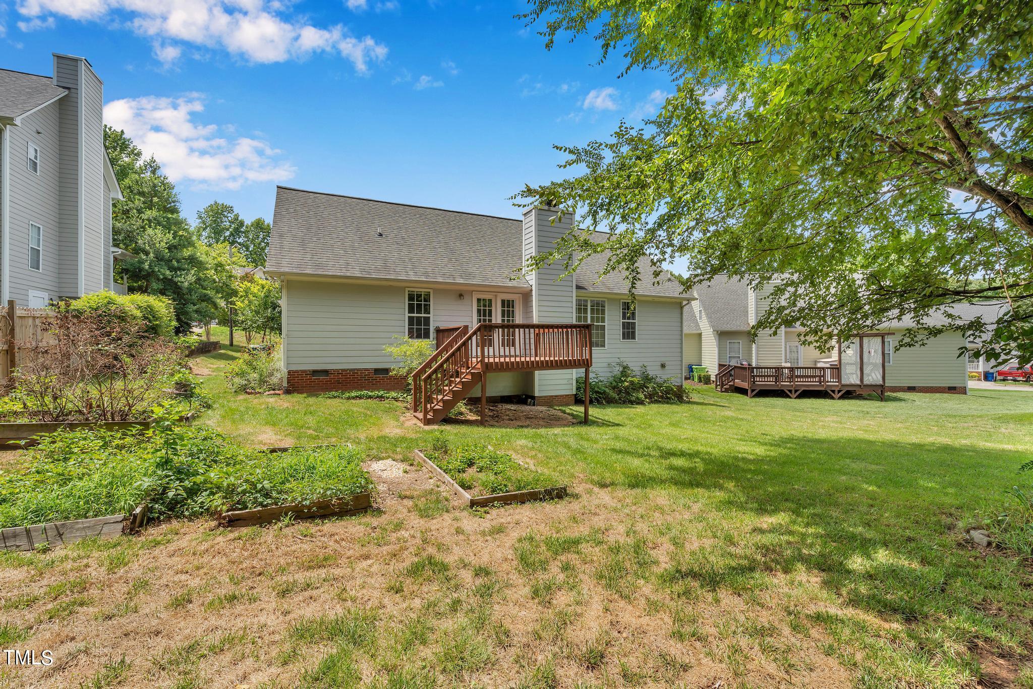 2505 Tryon Pines Drive Raleigh, NC 27603 - Photo 20 of 21 a front view of a house with a garden