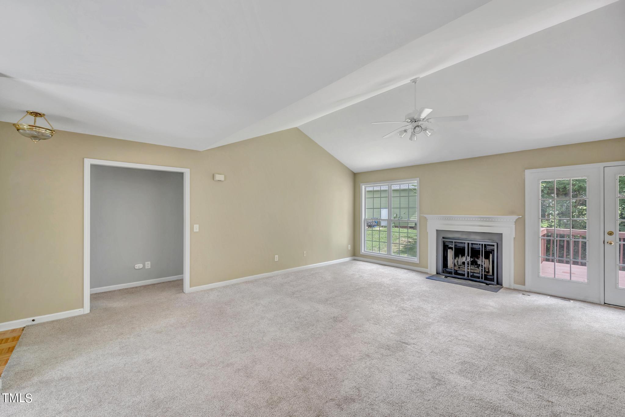 2505 Tryon Pines Drive Raleigh, NC 27603 - Photo 5 of 21 a view of livingroom with a fireplace a window and a fireplace