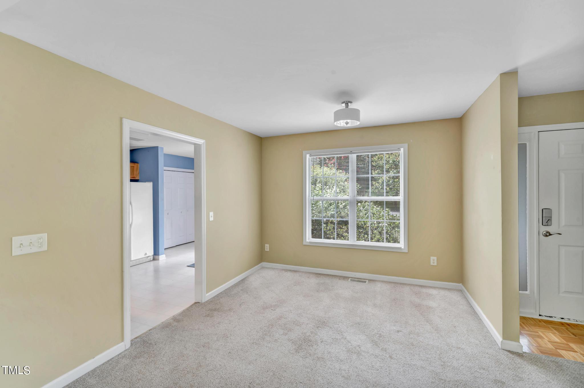 2505 Tryon Pines Drive Raleigh, NC 27603 - Photo 7 of 21 a view of an empty room with a window