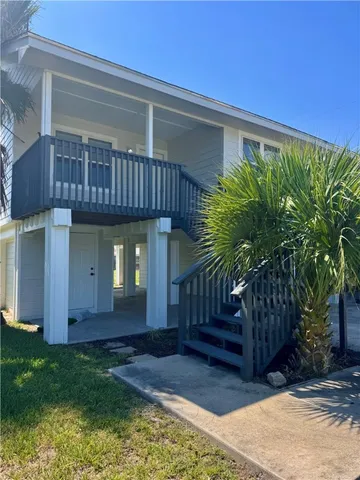 a view of house with porch and entertaining space