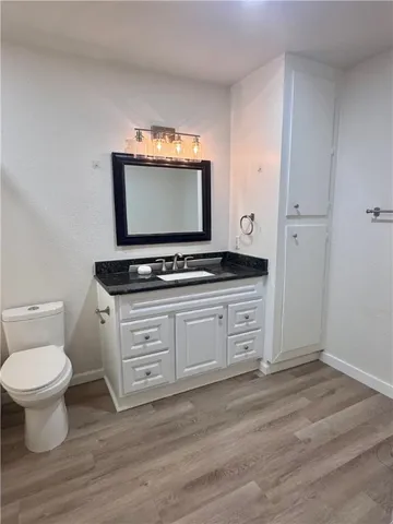 a view of a sink and a toilet in a room