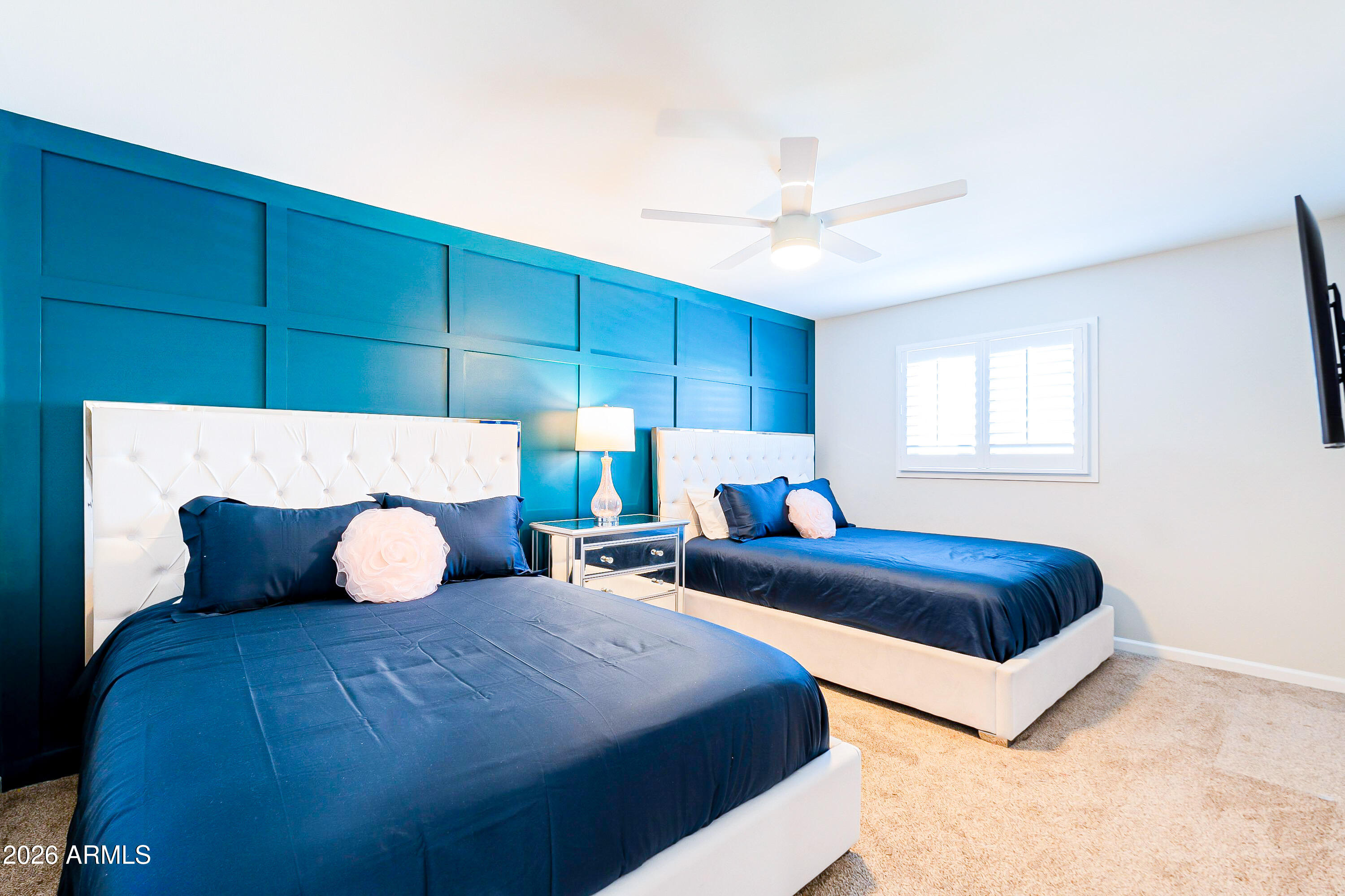 4243 North Miller Road Scottsdale, AZ 85251 - Photo 14 of 24 a bedroom with bed and window