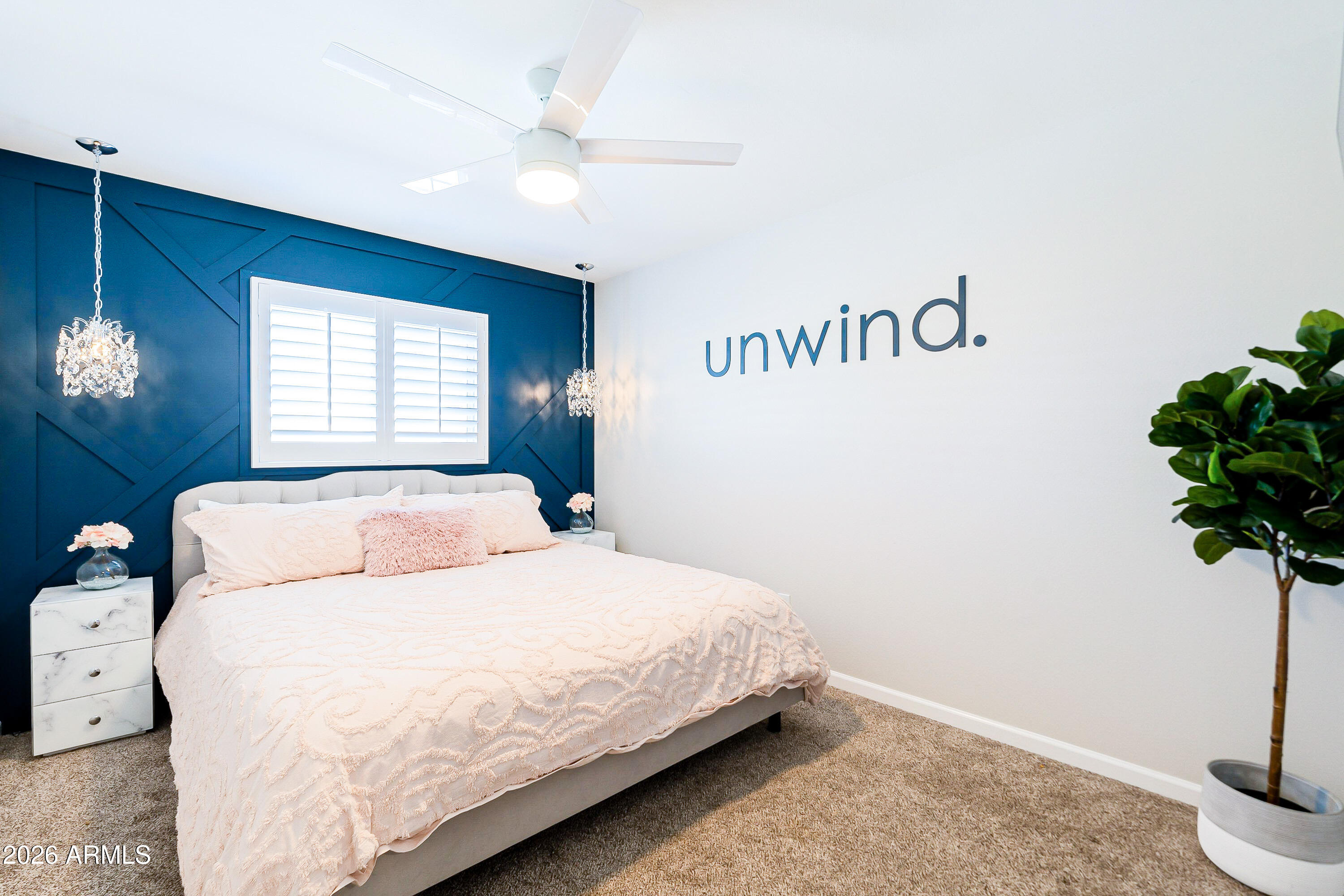 4243 North Miller Road Scottsdale, AZ 85251 - Photo 16 of 24 a bedroom with a bed and a potted plant