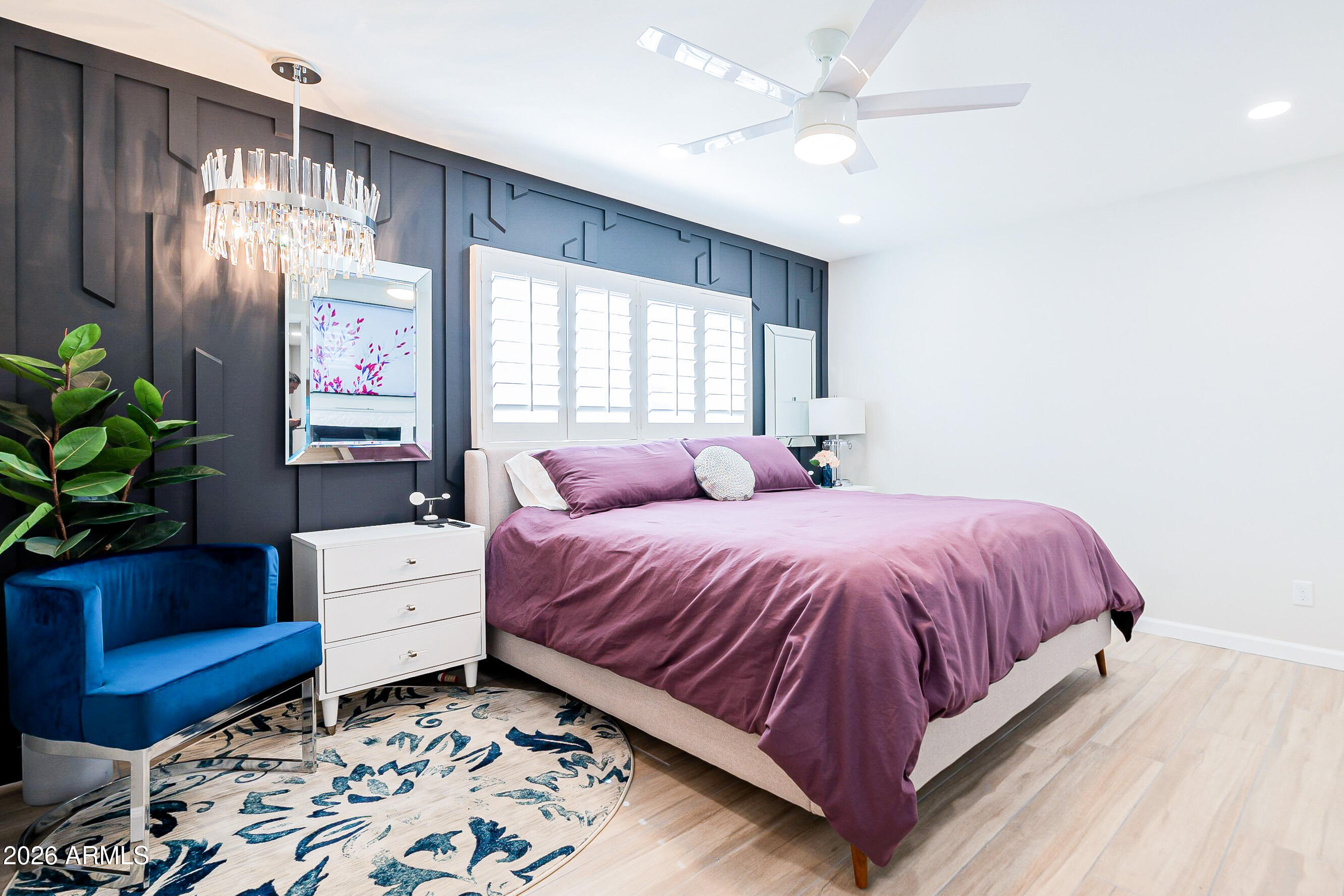 4243 North Miller Road Scottsdale, AZ 85251 - Photo 17 of 24 a spacious bedroom with a bed dresser and a window