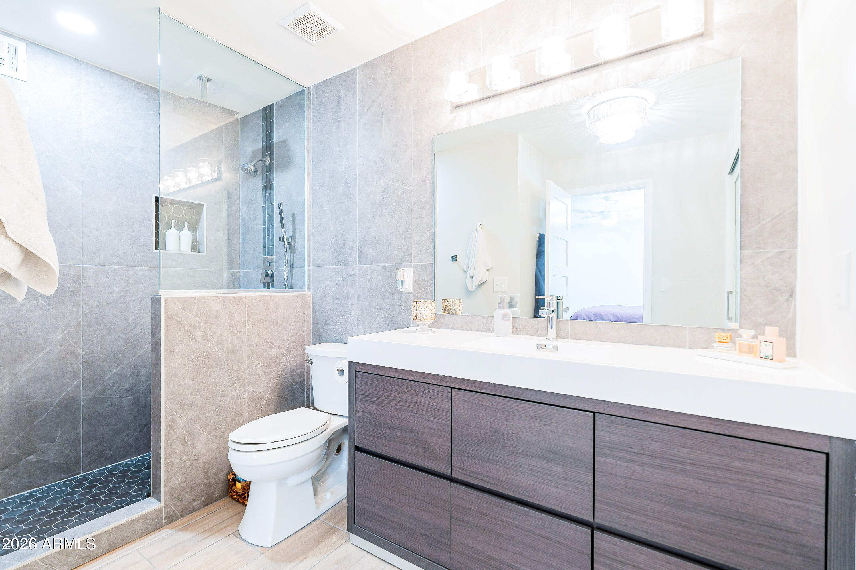 4243 North Miller Road Scottsdale, AZ 85251 - Photo 19 of 24 a bathroom with a sink toilet and shower