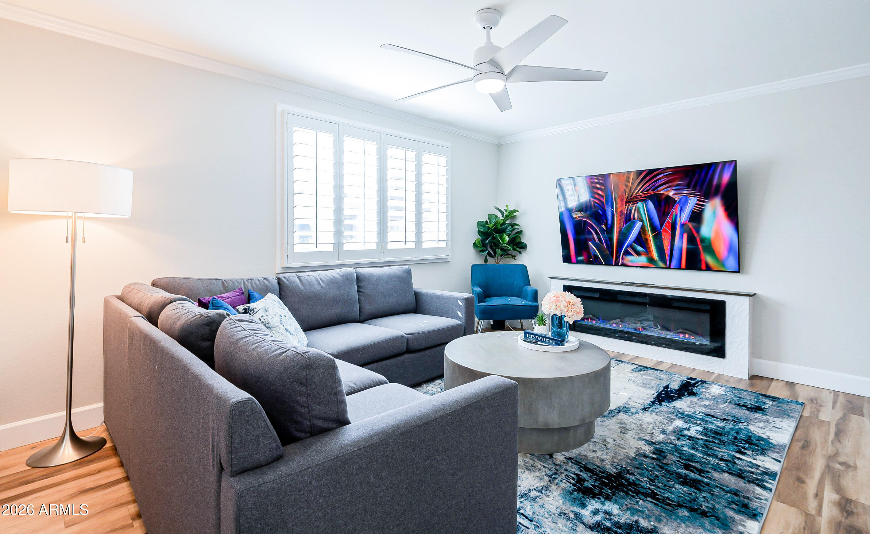 4243 North Miller Road Scottsdale, AZ 85251 - Photo 2 of 24 a living room with furniture a rug and a window