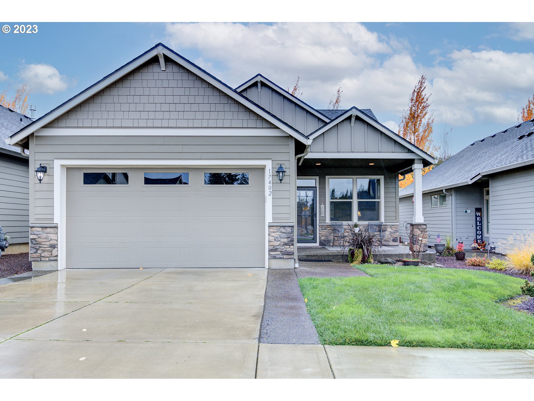 17402 Northeast 16th Avenue Ridgefield, WA 98642 - Photo 1 of 32 a front view of a house with a garden and patio